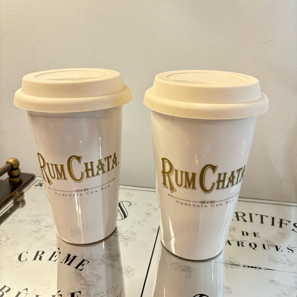 Pair of Rum Chata Glass mugs with Rubber Tops